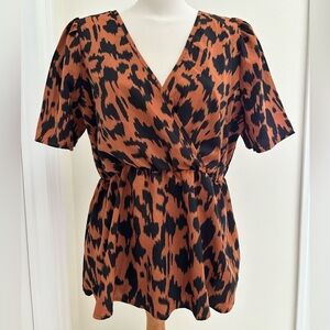 Women’s graphic print peplum wrap style blouse